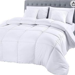 White fluffy comforter never opened or used.